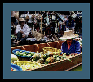 WOMAN VENDOR AT A FLOATING MARKET IN THAILAND 03