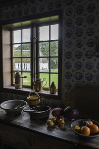 Rustic Kitchen Scene with Vintage Utensils and Fresh Produce