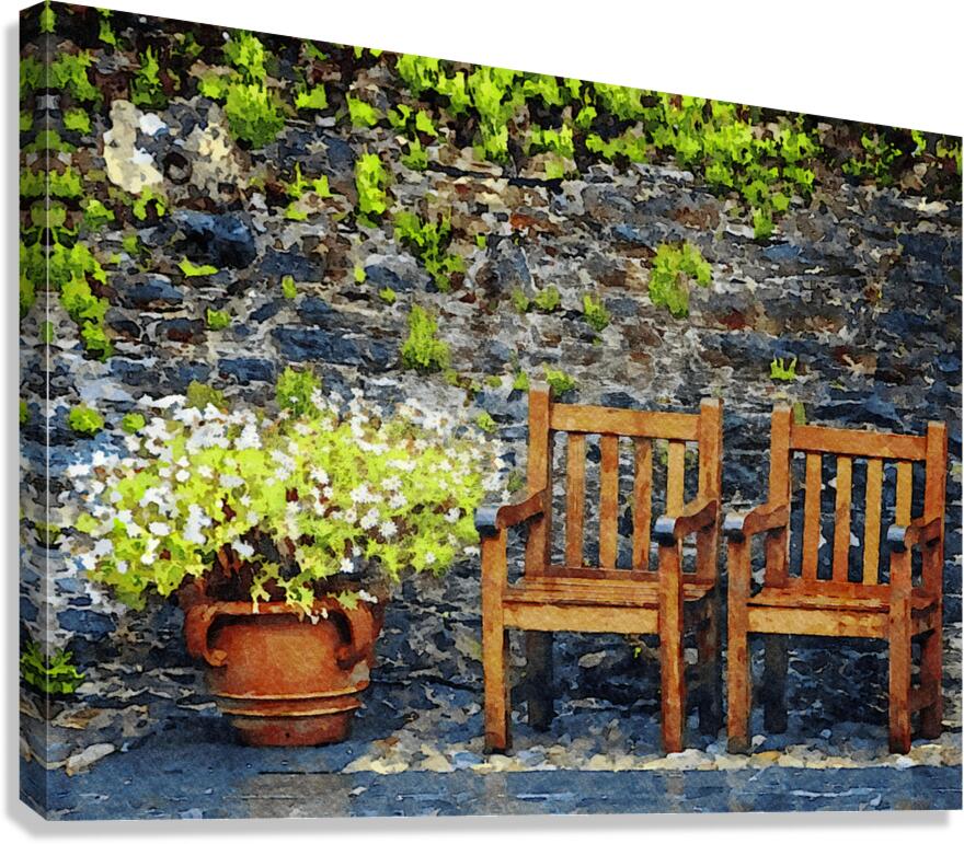 Rustic garden scene with wooden chairs and vibrant flowers Canvas Print