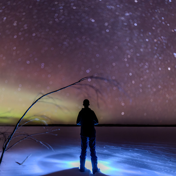 Embracing Solitude: Finding Light Amidst Darkness Under Pinehouses Northern Lights by Dre Erwin Photography