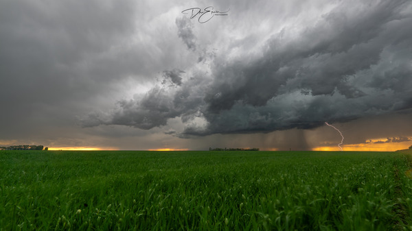 a Saskatchewan thunderstorm rolling across the prairies. by Dre Erwin Photography