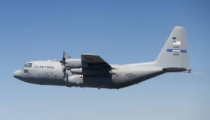 A specially modified C-130 Hercules in flight.