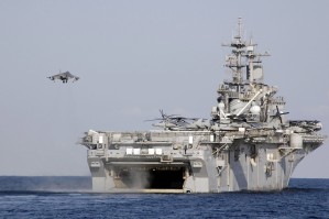 An AV-8B Harrier prepares to land on board amphibious assault ship USS Essex.