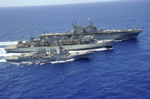 USS Peleliu and USS Spruance conduct a replenishment at sea with USNS Rainier.