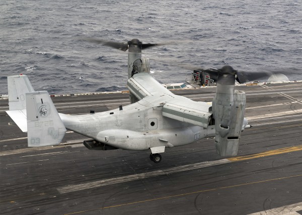A V-22 Osprey lands aboard the aircraft carrier USS Harry S. Truman. by StocktrekImages