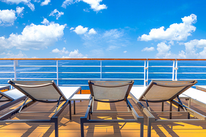 Luxury cruise ship sailing in the sea on Caribbean vacation. Scenic ocean views from deck