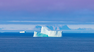 Iceberg seen from cruise ship vacation near Greenland coast in Arctic circle near Ilulissat Disko Bay