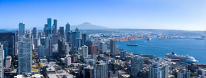Panoramic Seattle financial district skyline in city downtown with Mount Rainier in the background