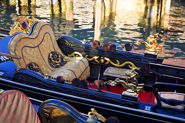 Luxury Gondola waiting for tourists near Rialto Bridge in Venice by Elijah Lovkoff