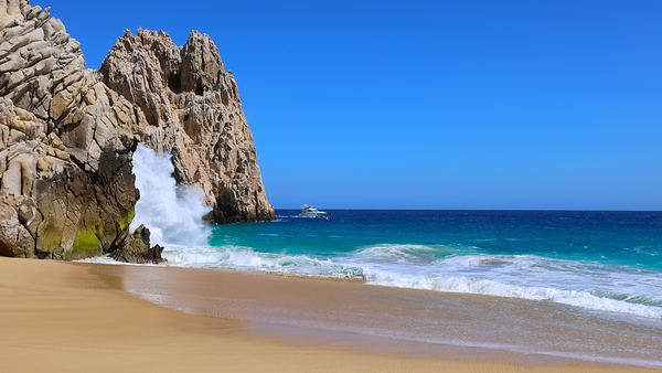 Scenic travel destination Playa del Divorcio Divorce Beach located near scenic Arch of Cabo San Lucas by Elijah Lovkoff
