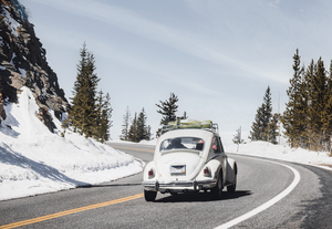 Volkswagen Bug Drives Through the Mountains