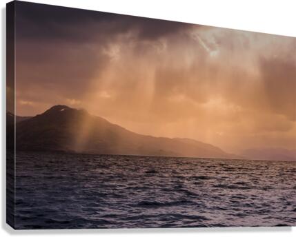 Sun peaking through rain clouds Canvas Print