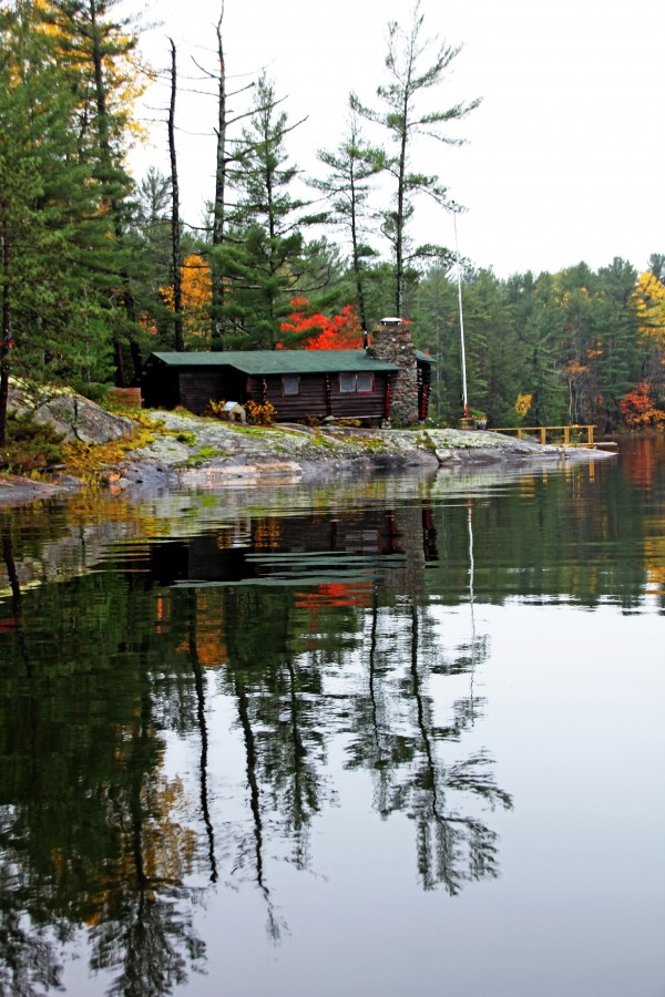 Cabin On  The Rocks by Deb Oppermann