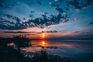 Majestic Nature- Dramatic sunset reflected in water landscape.