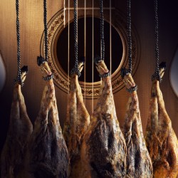 Dry Spanish ham Jamon Serrano Bellota Italian Prosciutto Crudo or Parma ham.Slicing Spanish iberic ham. Design Spanish jamon and spanish guitar traditional food and culture.