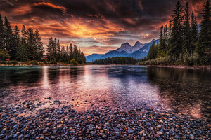 Colourful sunrise over The Three Sisters in Canmore