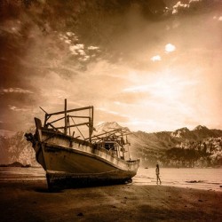 Old Ship on the seaside and woman