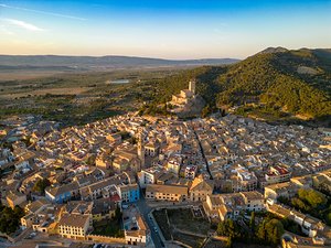 Aerial view of Biar city at sunset. Beautiful medieval city. Fortress on top of the hill. 