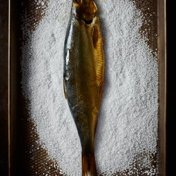 Smoked fish on salt bed