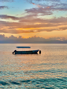 Lonely Boat at Sunset