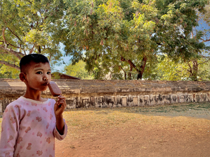 Myanmar Boy Eating a Frozen Candy Bar