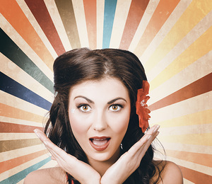 Beautiful retro brunette girl with surprised look