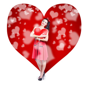 Valentines day woman holding love heart card