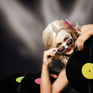 Music DJ girl holding audio vinyl record