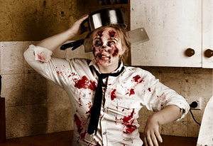 Funny zombie cook dancing in horror kitchen