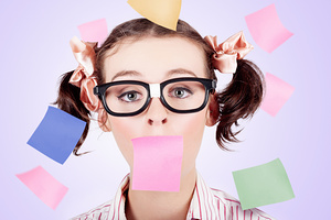Business Womans Face Covered In Paper Reminders