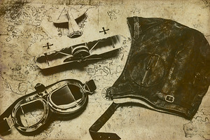 Goggles pouch and model biplane on map