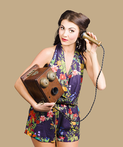 Retro receptionist on vintage telephone. Call us
