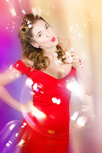 Beautiful pin-up girl at retro disco dance party