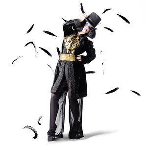 Entertainer dancing among falling feathers