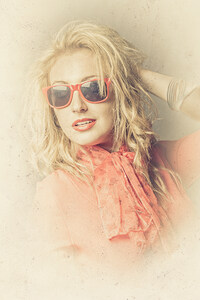 Stylish blond female beauty in vintage sunglasses