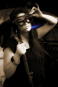 Female Mechanic Using Industrial Welder