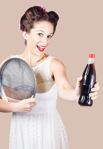 Retro pin-up girl giving bottle of soft drink