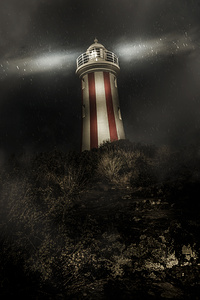 Tasmania lighthouse in rain storm. Guiding light