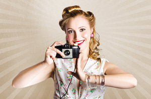 Beautiful Woman Photographer Holding Retro Camera