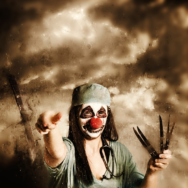 Scary clown doctor throwing knives outdoors by Jorgo
