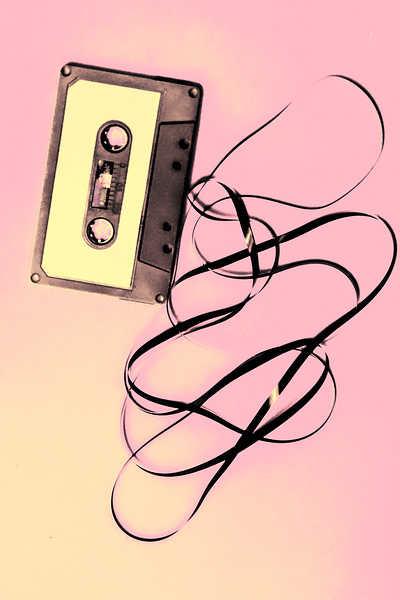 Old tape on pink background by Jorgo