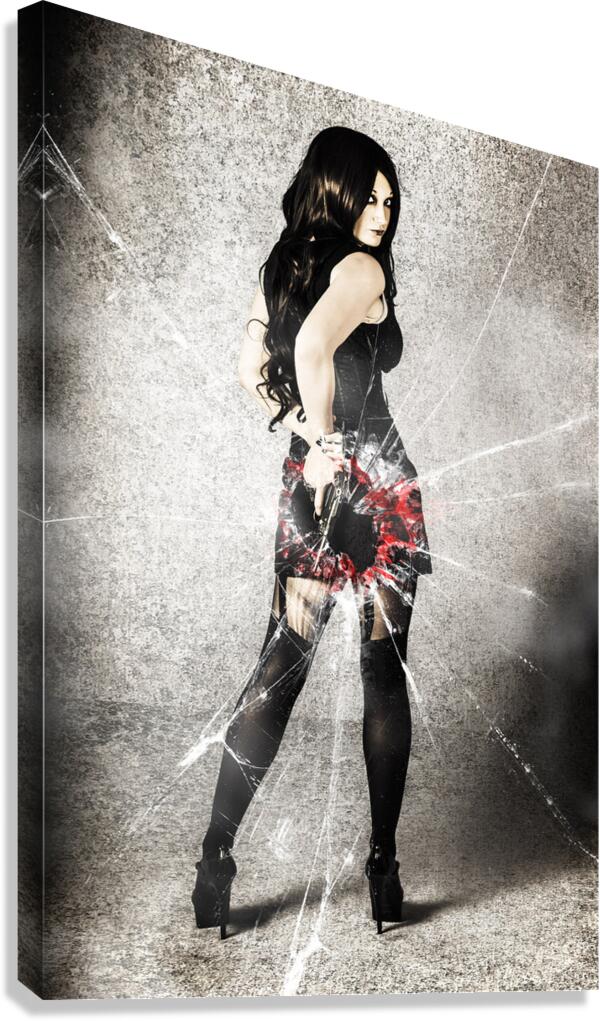 Sexy brunette woman holding gun with deadly style Canvas Print