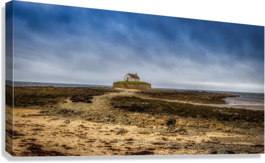 Mystical Beauty: Eglwys Cwyfan Church from Windswept Shores  Canvas Print