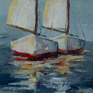 2 White and Red Sailboats Underway