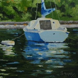 Small Blue Sailboat at Anchor