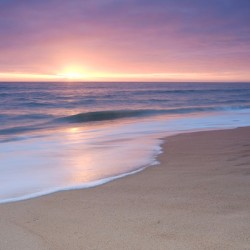 Calm Beach Waves During Sunset
