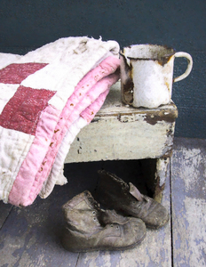 Baby Quilt and Worn Shoes