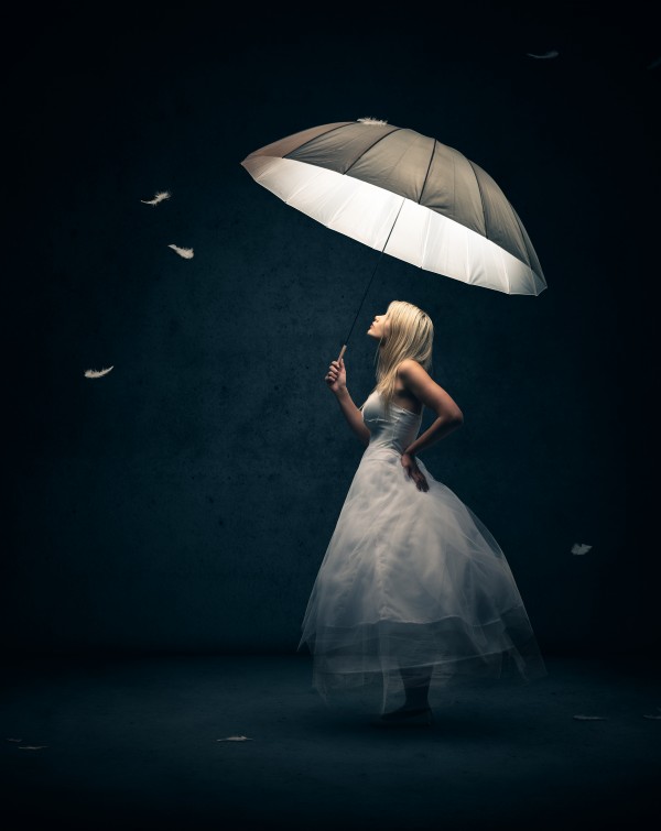 Girl with Umbrella and feathers by Johan Swanepoel