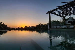 Santorini pool with sunrise