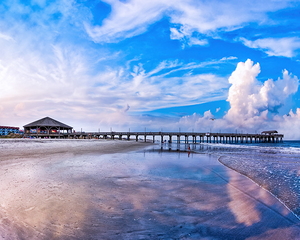 Tybee Island Pier Beneath Beautiful Skies On A Summer Afternoon